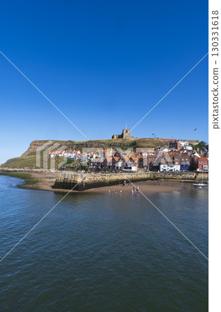 Whitby on North Yorkshire coast on clear sunny day 130331618