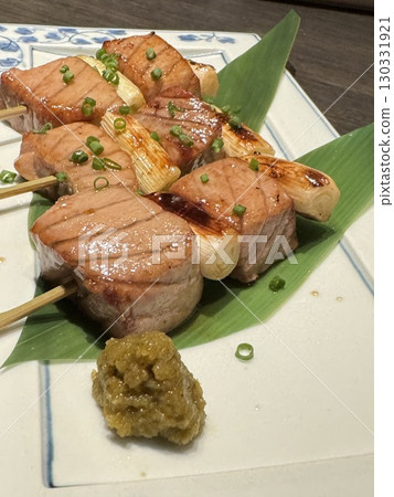 Savory grilled meat and green onion skewers Savory grilled meat and green onion skewers 130331921