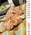 Savory grilled meat and green onion skewers 130331923