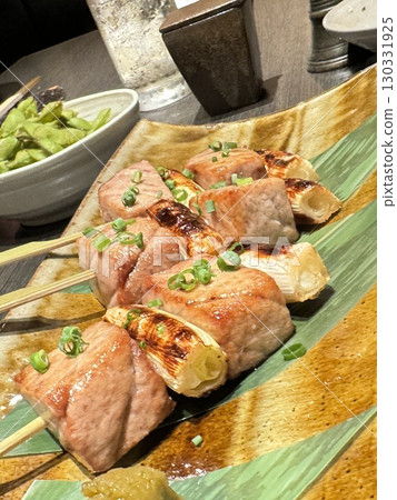 Savory grilled meat and green onion skewers Savory grilled meat and green onion skewers 130331925