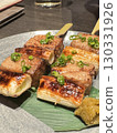 Savory grilled meat and green onion skewers 130331926