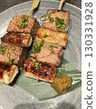 Savory grilled meat and green onion skewers 130331928