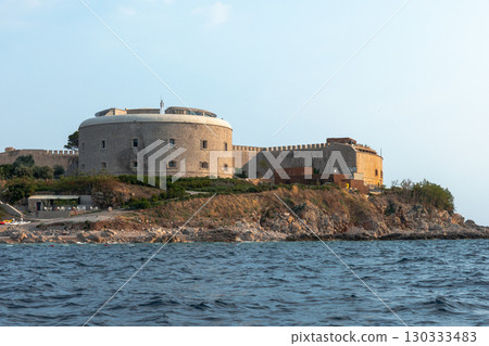 An ancient stone fort is perched on a small island, Mamula island, Montenegro 130333483