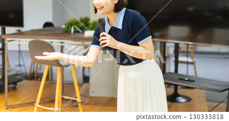 Woman speaking at a seminar 130333818