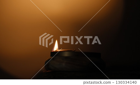 Faint Flame Diwali Candle In Silhouette 130334140