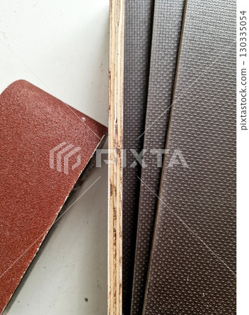 Wooden Plank Texture with Sandpaper Sheet for Surface Preparation Wooden Plank Texture with Sandpaper Sheet for Surface Preparation 130335054