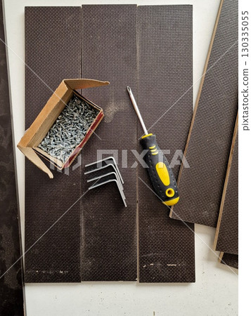 Wooden Boards with Metal Brackets, Screws and Screwdriver for DIY Project 130335055