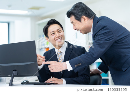 Middle-aged businessman working in the office 130335395