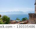 Beautiful view of the ocean with mountains in the background 130335486