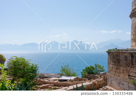 Beautiful view of the ocean with mountains in the background 130335486