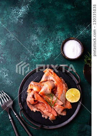 Salted sliced salmon fish with herbs 130335838