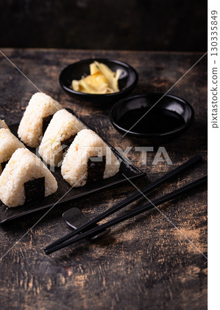 Onigiri, traditional japanese dish with rice 130335849