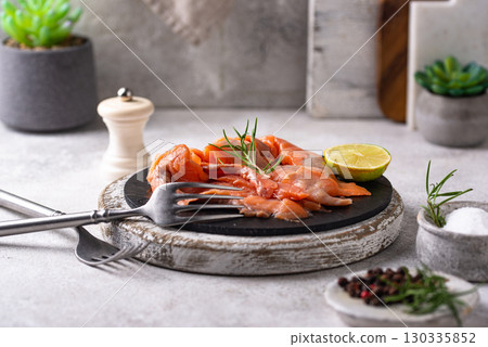 Salted sliced salmon fish with herbs 130335852