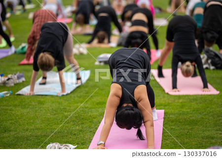 Group yoga session on stadium lawn in FYSM style Group yoga session on stadium lawn in FYSM style 130337016