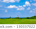 A resort golf course and green flag against the refreshing blue tropical sky and sea (Miyakojima City, Okinawa Prefecture) 130337022