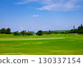 A resort golf course and green flag against the refreshing blue tropical sky and sea (Miyakojima City, Okinawa Prefecture) 130337154