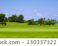 A resort golf course and green flag against the refreshing blue tropical sky and sea (Miyakojima City, Okinawa Prefecture) 130337322