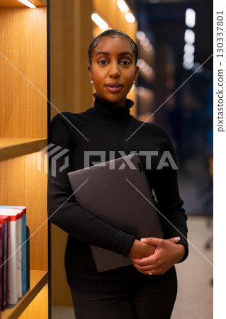 Student studying at a modern library Student studying at a modern library 130337801