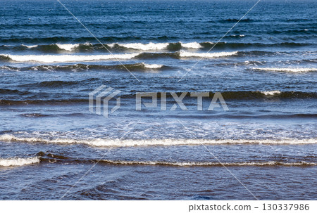 Ocean Incoming Tide with Waves on a Summer Morning for Background Ocean Incoming Tide with Waves on a Summer Morning for Background 130337986