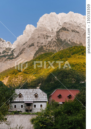 Landscape with Traditional Houses and Mountains in Theth Village 130338309