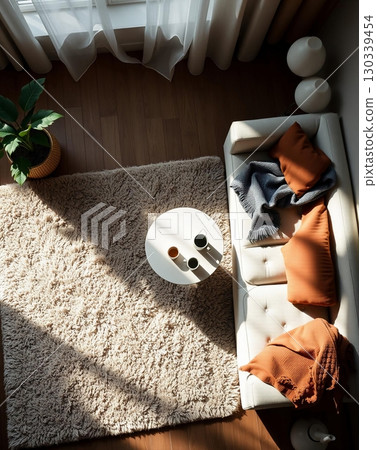 Cozy Living Room Corner: Warm Light, Soft Textures, and Relaxation 130339454