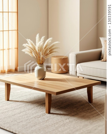 A cozy living room scene featuring a wooden coffee table and a vase of pampas grass. A cozy living room scene featuring a wooden coffee table and a vase of pampas grass. 130339591