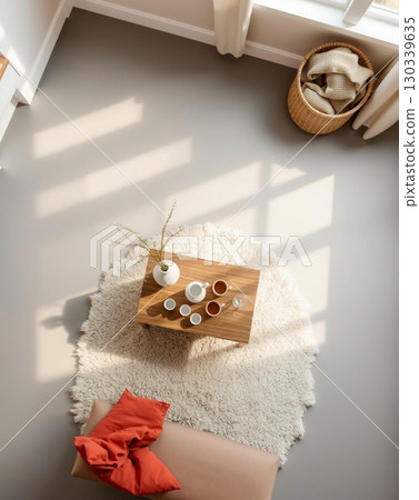 Elevated View of a Cozy Living Space with Wooden Accents and Natural Light 130339635