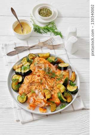 freshly baked salmon fillet with zucchini and dill 130340002