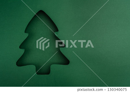 Minimalist Green Paper Cutout of Christmas Tree Silhouette Minimalist Green Paper Cutout of Christmas Tree Silhouette 130340075