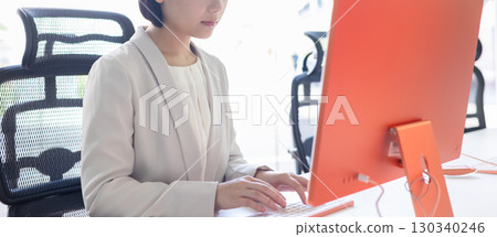 A young woman headed to a computer 130340246