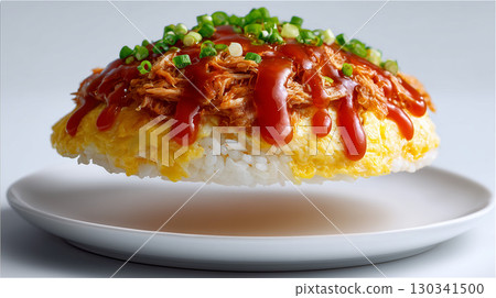 Omelette rice topped with ketchup and chicken floats on the plate. A popular Western dish. 130341500