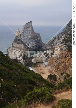 Majestic Coastal Cliffs Combined with a Beautifully Serene Beachscape Await Your Visit 130341546