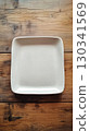 White ceramic square plate with slightly rounded edges and matte finish 130341569