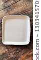 White ceramic square plate with slightly rounded edges and matte finish 130341570