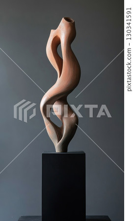 Surreal twisted clay sculpture with elongated distorted limbs on black pedestal 130341591