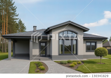 Modern single-story house with large windows, gray facade, and a neat front yard surrounded by trees. Generated AI. 130341829