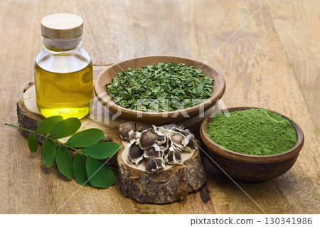 Moringa Ingredients on wooden background Moringa Ingredients on wooden background 130341986