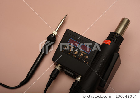 Black soldering station with hairdryer and soldering iron. Black soldering station with hairdryer and soldering iron. 130342014