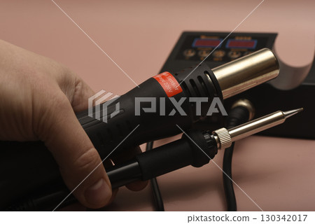 Black soldering station with hairdryer and soldering iron. 130342017
