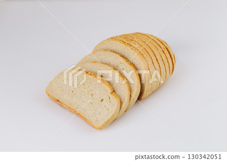 Sliced white bread loaf with sesame on white background, ideal for bakery or food packaging Sliced white bread loaf with sesame on white background, ideal for bakery or food packaging 130342051