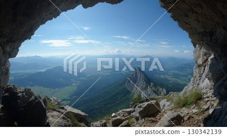 Breathtaking View of a Mountain Landscape Seen from a Cave Opening 130342139