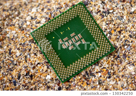 Close-up of a processor with sand in the background Close-up of a processor with sand in the background 130342250