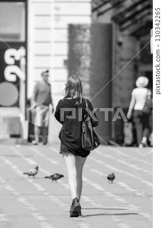 Woman walking on the street Woman walking on the street 130342265