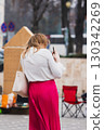 Woman taking a photo 130342269