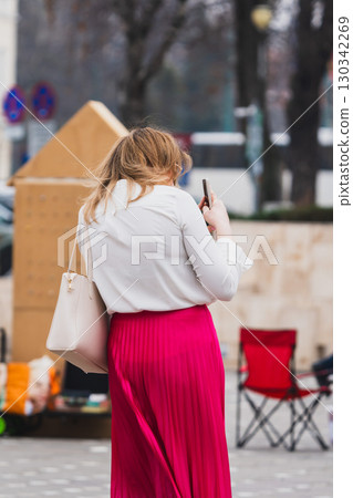 Woman taking a photo Woman taking a photo 130342269