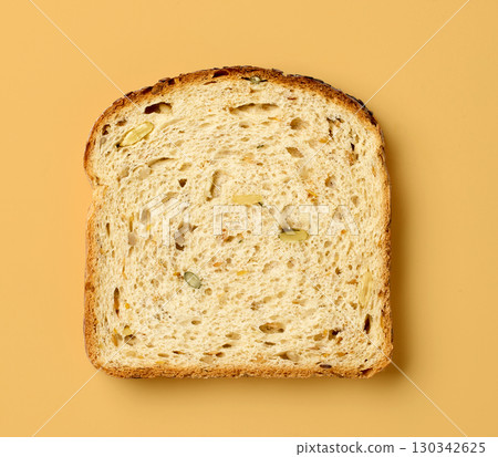 slice of bread on orange background slice of bread on orange background 130342625