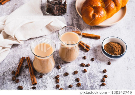 Yemeni coffee with spices and cream in glasses and crispy bread on the table Yemeni coffee with spices and cream in glasses and crispy bread on the table 130342749