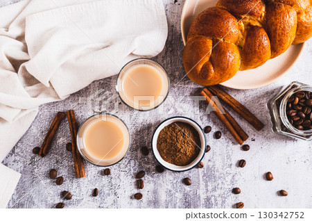 Yemeni coffee with cardamom, cinnamon and cream in glasses on table top view Yemeni coffee with cardamom, cinnamon and cream in glasses on table top view 130342752