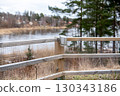 Modern stainless steel solar lamp mounted on fence 130343186