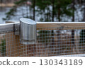 Modern stainless steel solar lamp mounted on fence 130343189